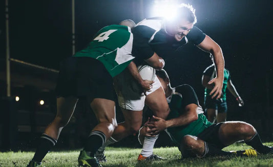 Late-match rugby player sprinting on grass, illustrating New Zealand blackcurrant repeated-sprint research.