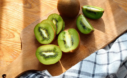 Green and gold kiwifruit with capsules for a Kiwi Superfoods NZ kiwifruit supplement guide