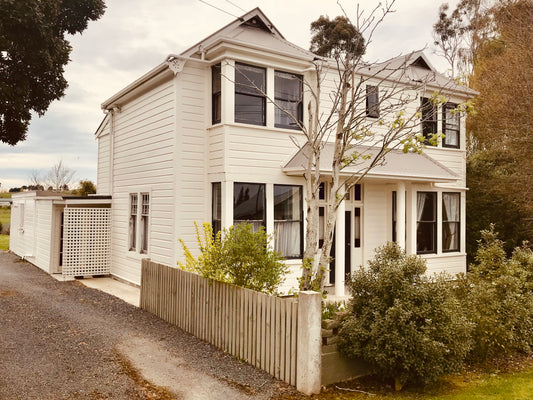 Freshly painted white two story family home in Stirling, South Otago